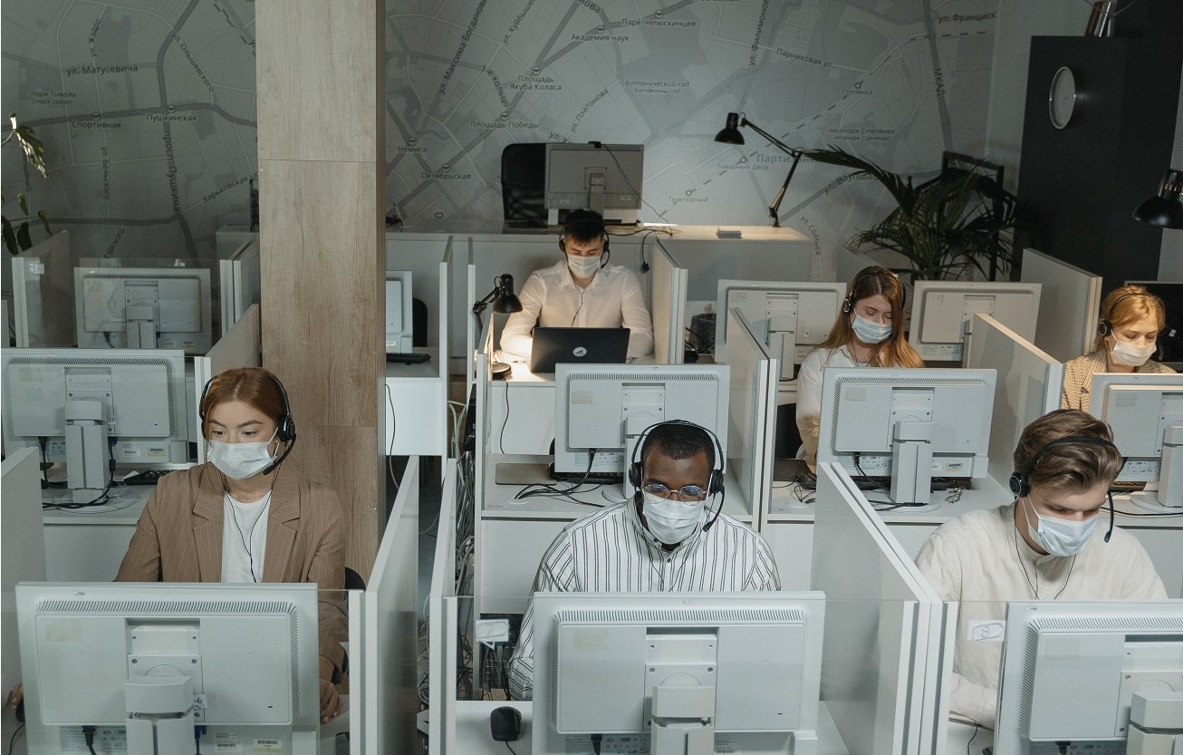 diverse group of people all working together in safe space
